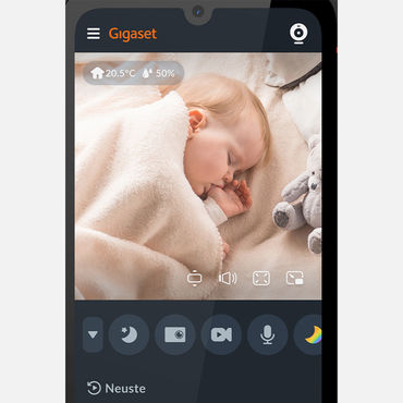 L'app del baby monitor Gigaset sullo smartphone mostra il bambino addormentato con l'indicatore di temperatura e umidità e le icone di controllo.